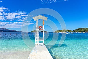 lookout pier in the crystal clear bathing area of Ã¢â¬â¹Ã¢â¬â¹Bora Bora beach in the town of Ksamil in Albania.